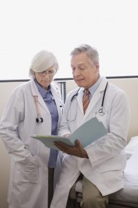 Doctors looking at file